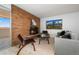 Bright living room featuring brick fireplace, modern furniture, and sliding doors to balcony at 2 Adams St # 905, Denver, CO 80206