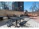 Outdoor patio area with seating, grill, and building views at 2 Adams St # 905, Denver, CO 80206