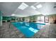 Bright indoor swimming pool area with natural light and tiled deck at 2 Adams St # 905, Denver, CO 80206