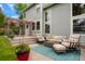 Backyard patio with a fire pit, comfortable seating, and outdoor dining area for entertainment at 2061 Chesapeake Pl, Highlands Ranch, CO 80126