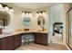 Elegant bathroom featuring dual sinks, granite countertops, and modern fixtures at 2061 Chesapeake Pl, Highlands Ranch, CO 80126