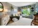 Cozy bedroom with a green and gray color scheme and lots of natural light at 2061 Chesapeake Pl, Highlands Ranch, CO 80126