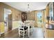 Charming dining room featuring a classic chandelier and ample natural light at 2061 Chesapeake Pl, Highlands Ranch, CO 80126