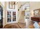 Grand foyer with hardwood floors, a staircase, and elegant decor at 2061 Chesapeake Pl, Highlands Ranch, CO 80126