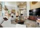 Spacious living room with a view of the second floor, wood flooring, and cozy furniture at 2061 Chesapeake Pl, Highlands Ranch, CO 80126