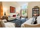 Bright living room featuring high ceilings, large windows, and comfortable seating at 2061 Chesapeake Pl, Highlands Ranch, CO 80126