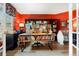 Home office space featuring hardwood floors, built-in shelving, and a bright workspace at 2061 Chesapeake Pl, Highlands Ranch, CO 80126