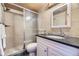 Clean bathroom with granite vanity and tiled shower at 1050 N Corona St # 215, Denver, CO 80218