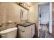 Updated bathroom, granite countertop, and tiled walls at 1050 N Corona St # 215, Denver, CO 80218