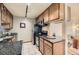 Modern kitchen with stainless steel appliances and granite countertops at 1050 N Corona St # 215, Denver, CO 80218