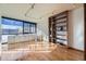 Bright living room with hardwood floors and built-in shelving at 1050 N Corona St # 215, Denver, CO 80218