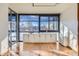 Living room with hardwood floors and stunning city views at 1050 N Corona St # 215, Denver, CO 80218