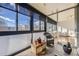 Sunroom with tiled floor and wicker furniture at 1050 N Corona St # 215, Denver, CO 80218