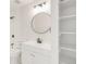 Bright bathroom features a modern vanity, stylish lighting, and shower-tub combination at 9685 W Chatfield Ave # A, Littleton, CO 80128