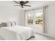 Bright bedroom with large windows that let in natural light and views of the outdoors at 9685 W Chatfield Ave # A, Littleton, CO 80128