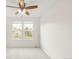Bright bedroom with two windows that let in natural light and neutral plush carpeting at 9685 W Chatfield Ave # A, Littleton, CO 80128