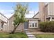 Charming townhome exterior with a well-manicured lawn and inviting entrance, showcasing lovely curb appeal at 9685 W Chatfield Ave # A, Littleton, CO 80128