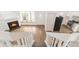 Inviting living area with fireplace, bright windows, and views of a modern kitchen at 9685 W Chatfield Ave # A, Littleton, CO 80128