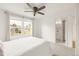 Main bedroom with scenic views from windows and an ensuite bathroom at 9685 W Chatfield Ave # A, Littleton, CO 80128