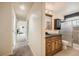 Well-lit bathroom with stylish vanity, vessel sink and a glass-enclosed shower at 2146 S Scranton Way, Aurora, CO 80014