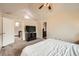 Large bedroom with vaulted ceilings, a ceiling fan, and doorways to other rooms at 2146 S Scranton Way, Aurora, CO 80014