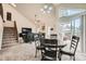 Inviting dining space with natural light, an open layout, and seamless flow to living area at 2146 S Scranton Way, Aurora, CO 80014