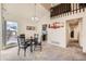 Comfortable dining area with view into the kitchen, and adjacent staircase to upper level at 2146 S Scranton Way, Aurora, CO 80014