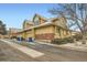 View of the exterior showcasing the roof line, siding and brick accents of the townhome at 2146 S Scranton Way, Aurora, CO 80014