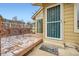 Inviting front porch with outdoor seating, stylish door, and a secure entrance at 2146 S Scranton Way, Aurora, CO 80014