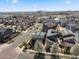 Aerial view of neighborhood showcasing lush landscaping, diverse home styles, and scenic surroundings at 1730 W 67Th Ave, Denver, CO 80221