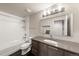 Bathroom with shower-tub combo and modern vanity at 1730 W 67Th Ave, Denver, CO 80221