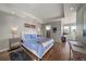 Bright bedroom boasts hardwood floors, tray ceilings, and neutral colored walls with a comfortable, inviting design at 1730 W 67Th Ave, Denver, CO 80221