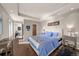 Spacious bedroom offers hardwood floors, tray ceilings, natural lighting, and a simple yet elegant interior design at 1730 W 67Th Ave, Denver, CO 80221