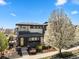 Attractive two-story home featuring brick accents, modern design, and a lush front yard with a flowering tree at 1730 W 67Th Ave, Denver, CO 80221