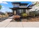 Inviting two-story home with modern architecture, brick accents, and a beautifully landscaped front yard at 1730 W 67Th Ave, Denver, CO 80221