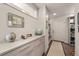 Hallway featuring built in storage and a bench at 1730 W 67Th Ave, Denver, CO 80221