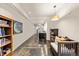 Open hallway with polished concrete floors leads to stairs and sitting area at 1730 W 67Th Ave, Denver, CO 80221