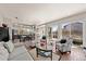 Open concept living space showcasing a modern kitchen, dining area and cozy seating area with outdoor access at 1730 W 67Th Ave, Denver, CO 80221