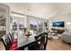 Open floor plan with dining area leading to a living room with sliding glass doors to the outdoor patio at 1730 W 67Th Ave, Denver, CO 80221