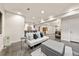 Comfortable living room featuring a futon, ottoman, and stylish decor for a welcoming atmosphere at 1730 W 67Th Ave, Denver, CO 80221