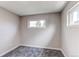 Bright bedroom features a window offering plenty of natural light and neutral gray carpet at 9280 Russell Way, Thornton, CO 80229