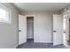 Bright bedroom features a closet, a window offering natural light and neutral gray carpet at 9280 Russell Way, Thornton, CO 80229