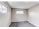 Bright bedroom features two windows offering plenty of natural light and neutral gray carpet at 9280 Russell Way, Thornton, CO 80229