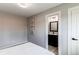 Comfortable bedroom with an ensuite bathroom featuring modern lighting at 9280 Russell Way, Thornton, CO 80229