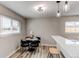 Cozy dining area features a round table, stylish chairs, and modern lighting at 9280 Russell Way, Thornton, CO 80229