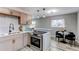 Renovated kitchen featuring stainless appliances, stylish cabinets and a cozy eat-in space at 9280 Russell Way, Thornton, CO 80229