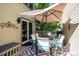 Deck with outdoor dining set, umbrella, and gray patterned rug at 6324 S Grape Ct, Centennial, CO 80121