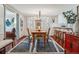 Elegant dining room with a wooden table and a view into the kitchen at 6324 S Grape Ct, Centennial, CO 80121