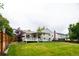 Expansive backyard featuring a well-maintained lawn and a deck perfect for outdoor entertaining at 4760 S Wright Way, Morrison, CO 80465