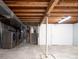 Spacious unfinished basement with exposed beams and updated utility connections, perfect for storage or customization at 4760 S Wright Way, Morrison, CO 80465